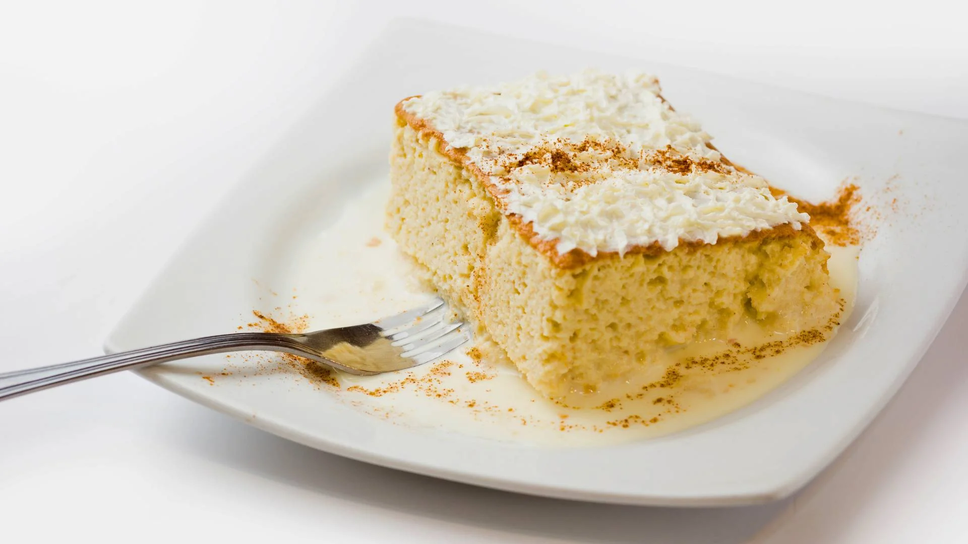 sweet Venezuelan tres leches cake - key ingredients of Venezuelan cuisine - frozen mosaic